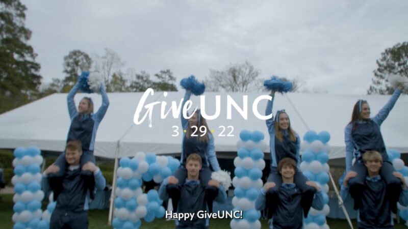 Give UNC 2022 video with cheerleaders in the background.