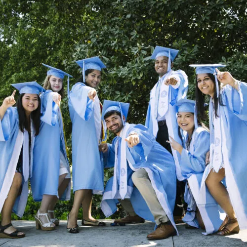 Students gathered celebrating their commencement.