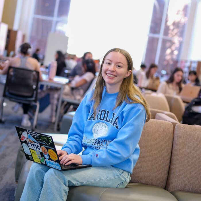 Abby Oldt in Library on laptop