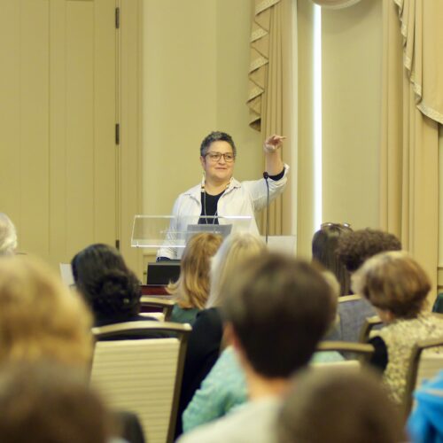 Person speaking at podium at Michael D. Green Lecture for AIC