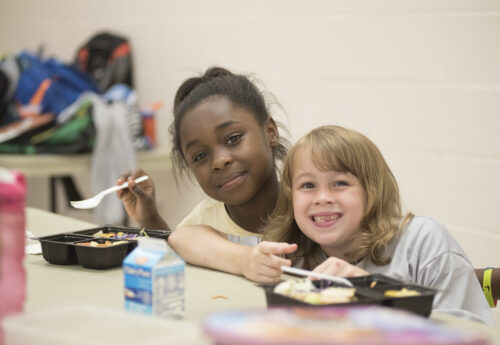 Two little girls eating