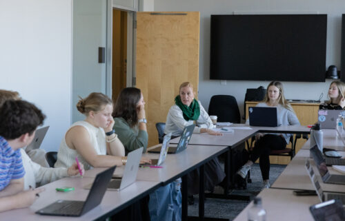 Erinn Whitaker engages in a simulation on the use of drones in Pakistan in her first-year seminar.
