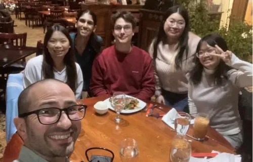 Kevin Fogg and his student team celebrate over Malaysian cuisine before presenting their policy recommendations to the U.S. Mission in Jakarta