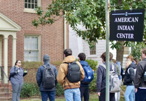 Students heading into the American Indian Center on a sunny day.