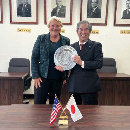 UNC Vice Provost for Global Affairs Barbara Stephenson and Nagoya University President Naoshi Sugiyama in Japan with the UNC seal.