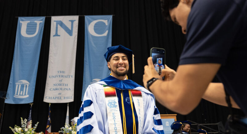 Student at doctoral hooding ceremony