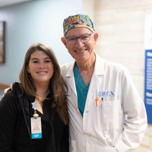 A UNC Rex doctor and nurse practitioner posing together