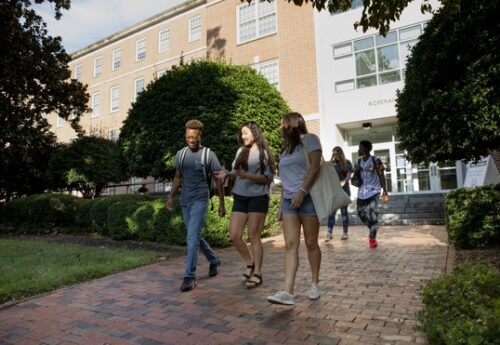 students walking through campus