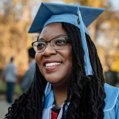 Headshot of a graduate in a cap and gown