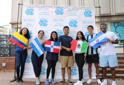 students with flags at unc