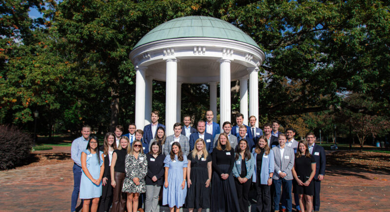Group photo of the 2023 Young Alumni Leadership Council (YALC) on October 20, 2023 at the Old Well on the campus of UNC-Chapel Hill in Chapel Hill, NC.