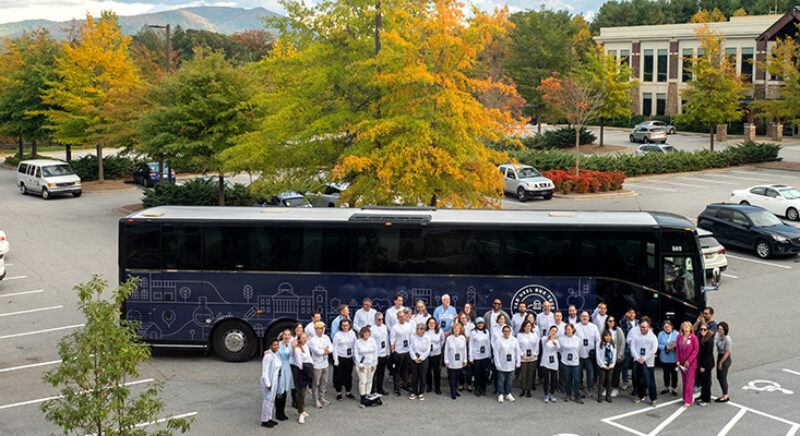 Tar Heel Bus Tour 2023 West bus makes a stop at the Mountain Area Health Education Center (MAHEC) and UNC Asheville Pharmacy Program in Asheville, NC.