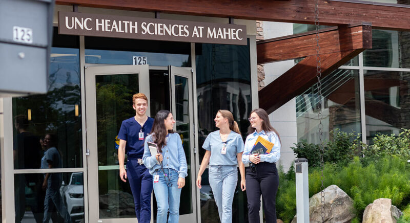UNC students gather on the UNC Health Sciences at MAHEC branch campus in Asheville; former UNC SOM student and Kenan Scholar, current MAHEC Rural Innovation Fellow Travis Williams serves rural WNC.