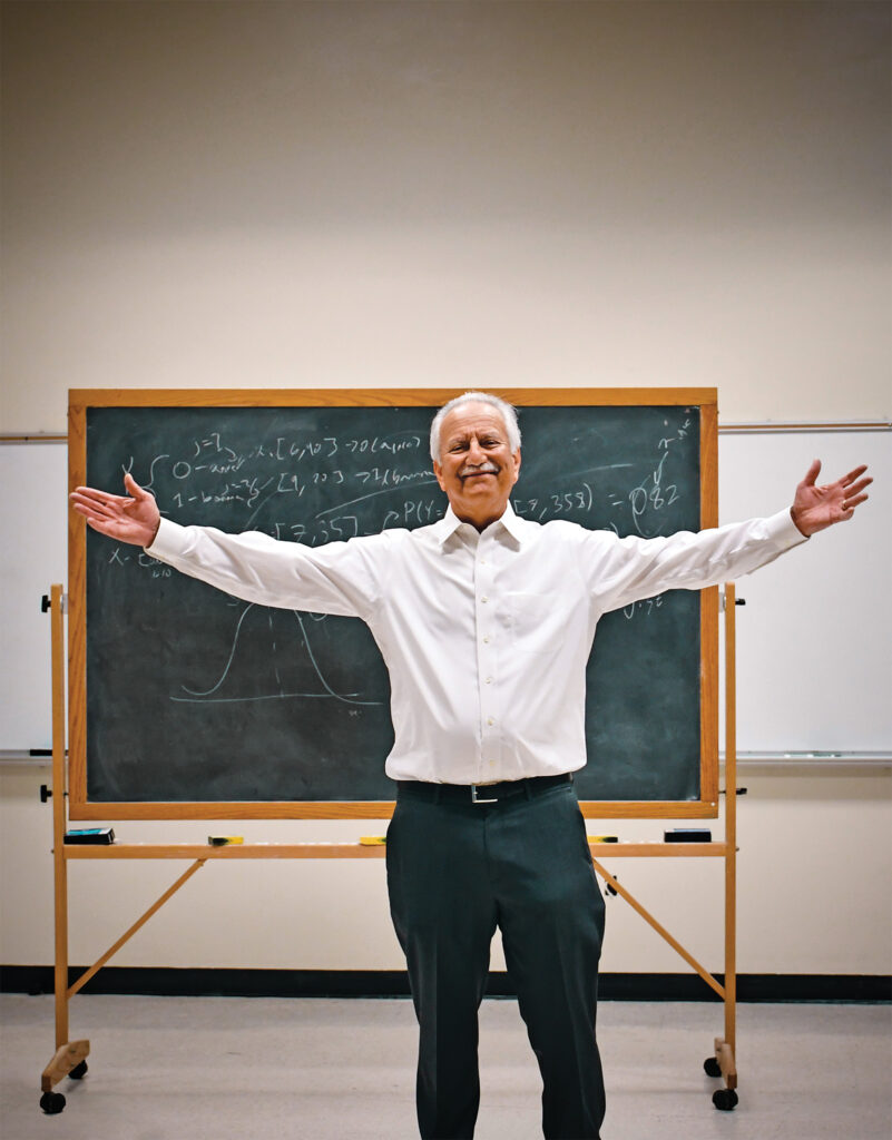  Dean Gary Marchionini standing in front of a chalk board