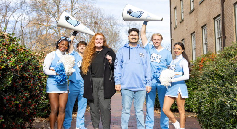 Carolina students being cheered on by Carolina cheerleaders for GiveUNC