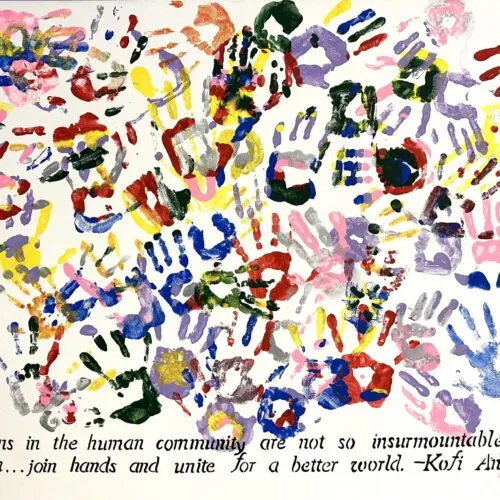 Multi-colored hand prints on canvas