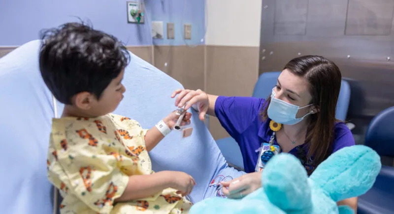 UNC Health staff treats a young patient.